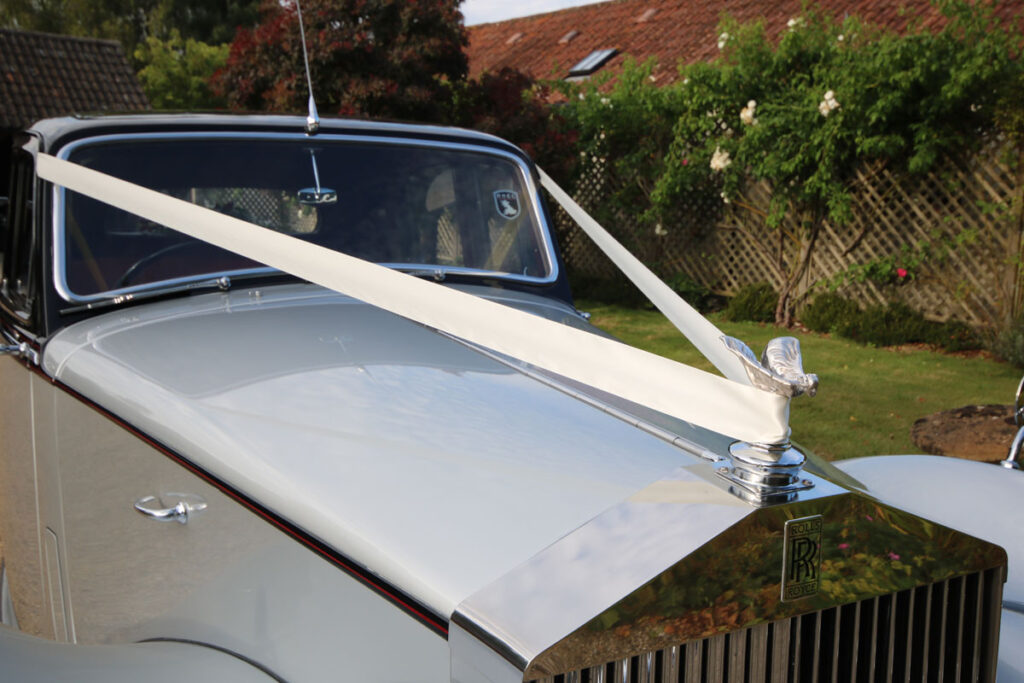 Wedding Car Hire Dorset, 1954 Rolls Royce Silver Dawn, Poppy wedding car Dorset, classic wedding car Dorset, vintage Rolls Royce hire, chauffeur-driven wedding car, red leather wedding car interior, timeless wedding transport, Rolls Royce Shillingstone, elegant bridal car Dorset, heritage wedding vehicle