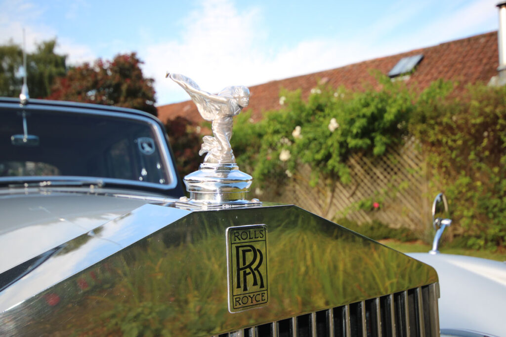 Wedding Car Hire Dorset, 1954 Rolls Royce Silver Dawn, Poppy wedding car Dorset, classic wedding car Dorset, vintage Rolls Royce hire, chauffeur-driven wedding car, red leather wedding car interior, timeless wedding transport, Rolls Royce Shillingstone, elegant bridal car Dorset, heritage wedding vehicle