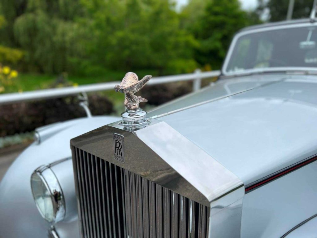 Wedding Car Hire Dorset, 1954 Rolls Royce Silver Dawn, Poppy wedding car Dorset, classic wedding car Dorset, vintage Rolls Royce hire, chauffeur-driven wedding car, red leather wedding car interior, timeless wedding transport, Rolls Royce Shillingstone, elegant bridal car Dorset, heritage wedding vehicle