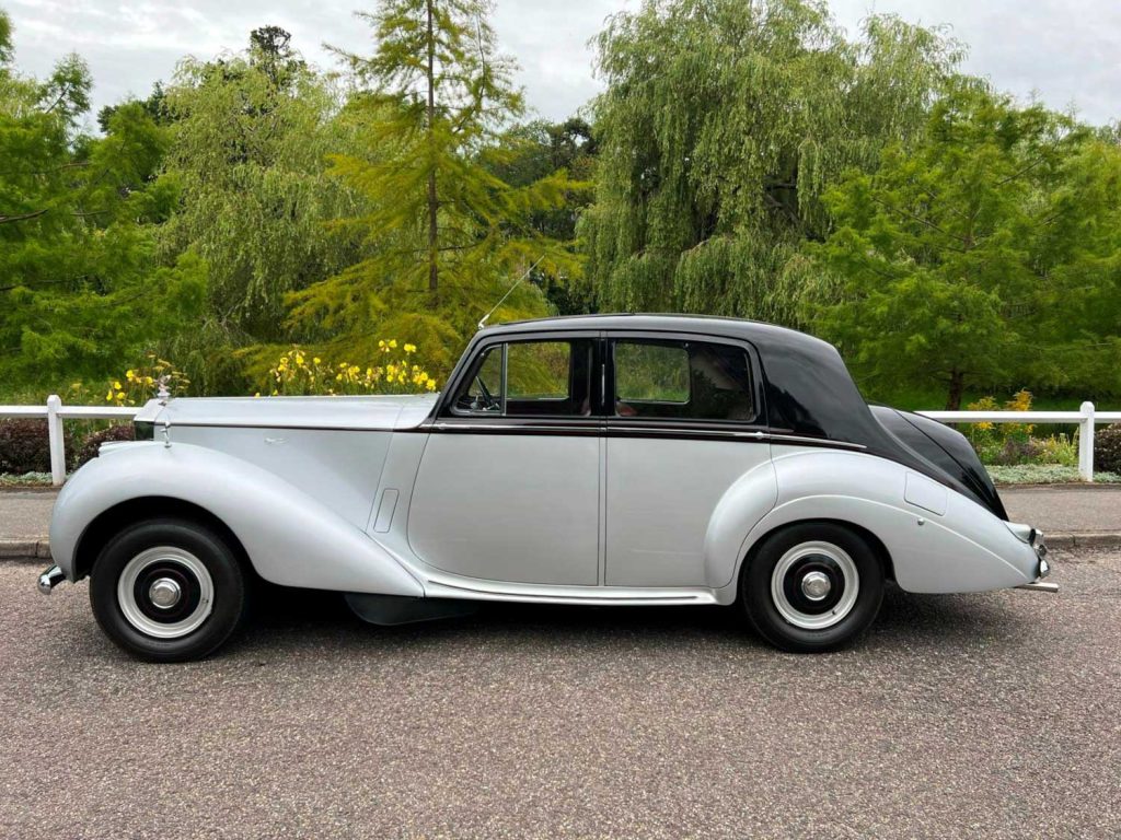 Wedding Car Hire Dorset, 1954 Rolls Royce Silver Dawn, Poppy wedding car Dorset, classic wedding car Dorset, vintage Rolls Royce hire, chauffeur-driven wedding car, red leather wedding car interior, timeless wedding transport, Rolls Royce Shillingstone, elegant bridal car Dorset, heritage wedding vehicle