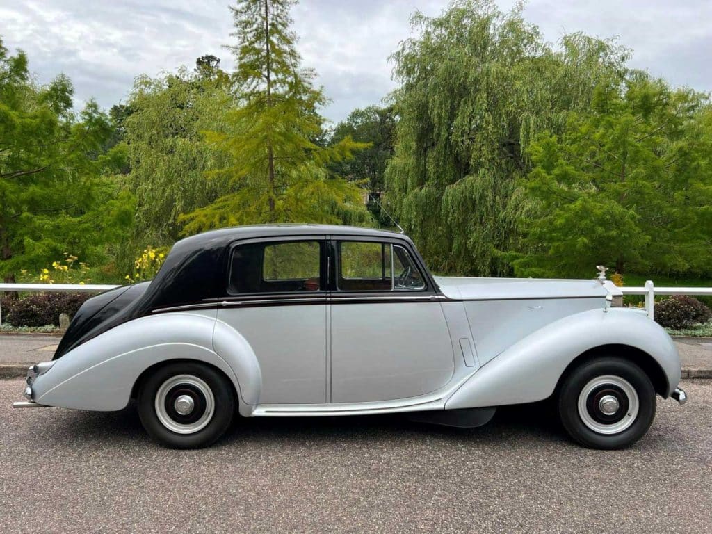 Wedding Car Hire Dorset, 1954 Rolls Royce Silver Dawn, Poppy wedding car Dorset, classic wedding car Dorset, vintage Rolls Royce hire, chauffeur-driven wedding car, red leather wedding car interior, timeless wedding transport, Rolls Royce Shillingstone, elegant bridal car Dorset, heritage wedding vehicle