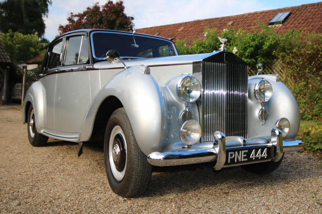 Wedding Car Hire Dorset, 1954 Rolls Royce Silver Dawn, Poppy wedding car Dorset, classic wedding car Dorset, vintage Rolls Royce hire, chauffeur-driven wedding car, red leather wedding car interior, timeless wedding transport, Rolls Royce Shillingstone, elegant bridal car Dorset, heritage wedding vehicle, luxury wedding car, wedding cars dorset,