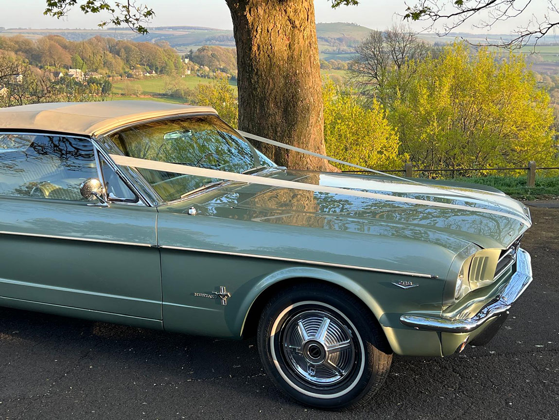 wedding car hire dorset, 1965 Mustang wedding car, classic Mustang wedding car, American muscle wedding car, vintage Mustang Dorset, Wedding Cars Dorset, wedding car Dorset, wedding car Somerset, wedding car Hampshire, wedding car Wiltshire, Mustang bridal car, unique wedding car hire, alternative wedding car UK, classic car wedding Dorset, Mustang wedding vehicle hire