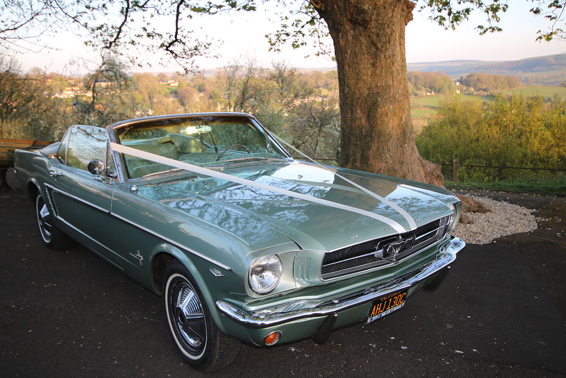 wedding car hire dorset, 1965 Mustang wedding car, classic Mustang wedding car, American muscle wedding car, vintage Mustang Dorset, Wedding Cars Dorset, wedding car Dorset, wedding car Somerset, wedding car Hampshire, wedding car Wiltshire, Mustang bridal car, unique wedding car hire, alternative wedding car UK, classic car wedding Dorset, Mustang wedding vehicle hire