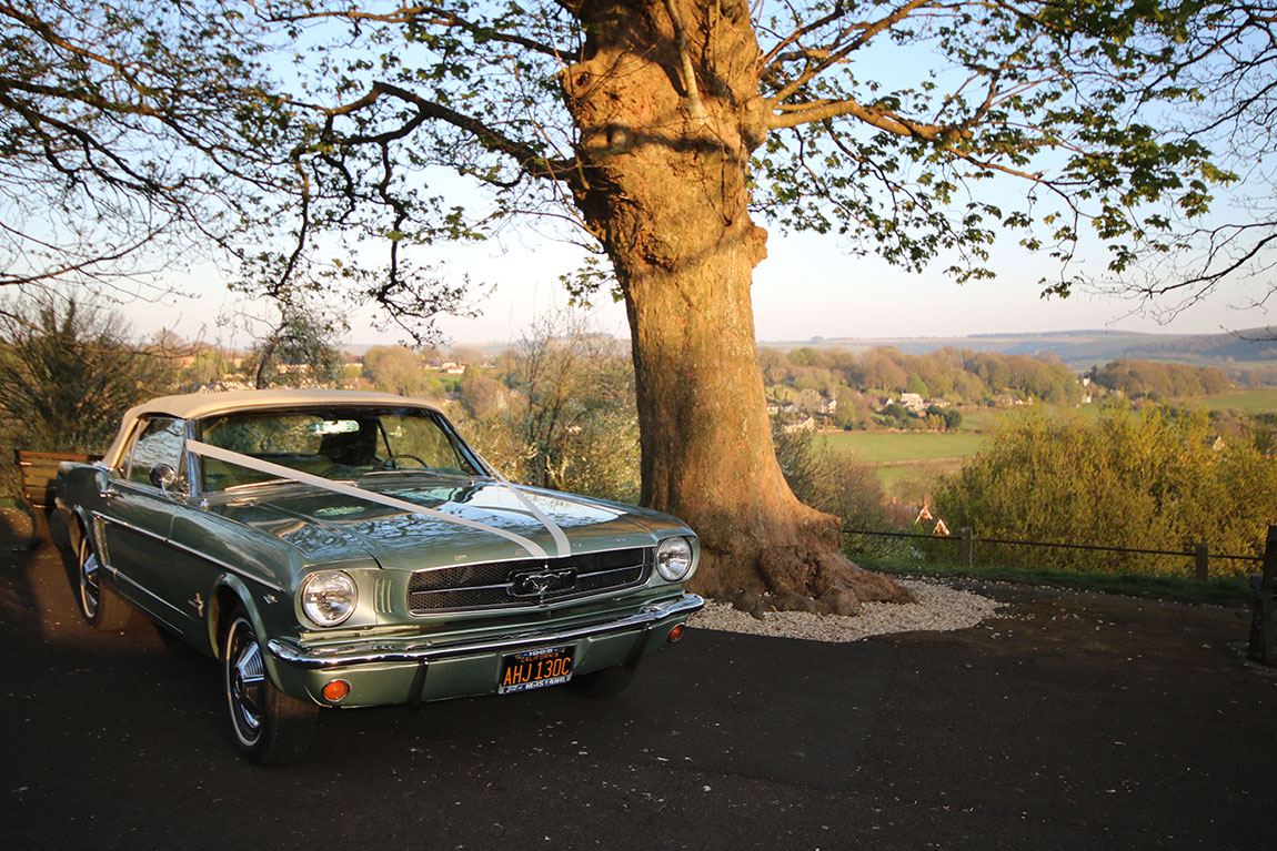 wedding car hire dorset, 1965 Mustang wedding car, classic Mustang wedding car, American muscle wedding car, vintage Mustang Dorset, Wedding Cars Dorset, wedding car Dorset, wedding car Somerset, wedding car Hampshire, wedding car Wiltshire, Mustang bridal car, unique wedding car hire, alternative wedding car UK, classic car wedding Dorset, Mustang wedding vehicle hire